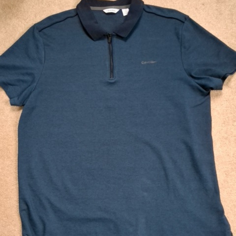 Calvin Klein Men's Dark Blue Zip-Up Polo Shirt.